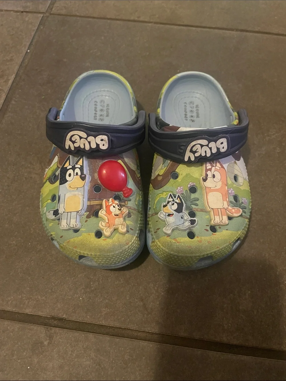 CROCS Kids Clog in Green with Navy Strap and Multicolor Characters